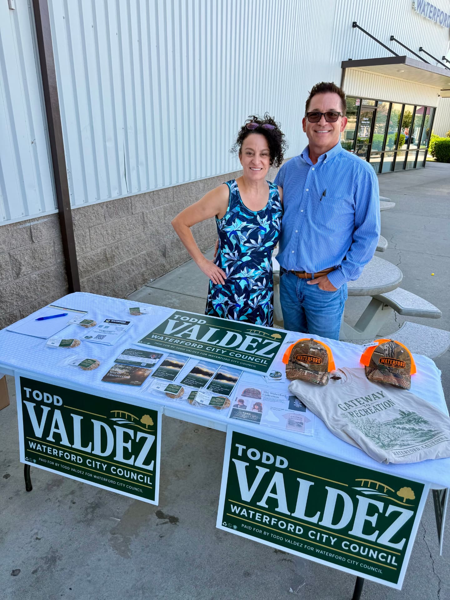 Todd and Deanna at a campaign table in Waterford