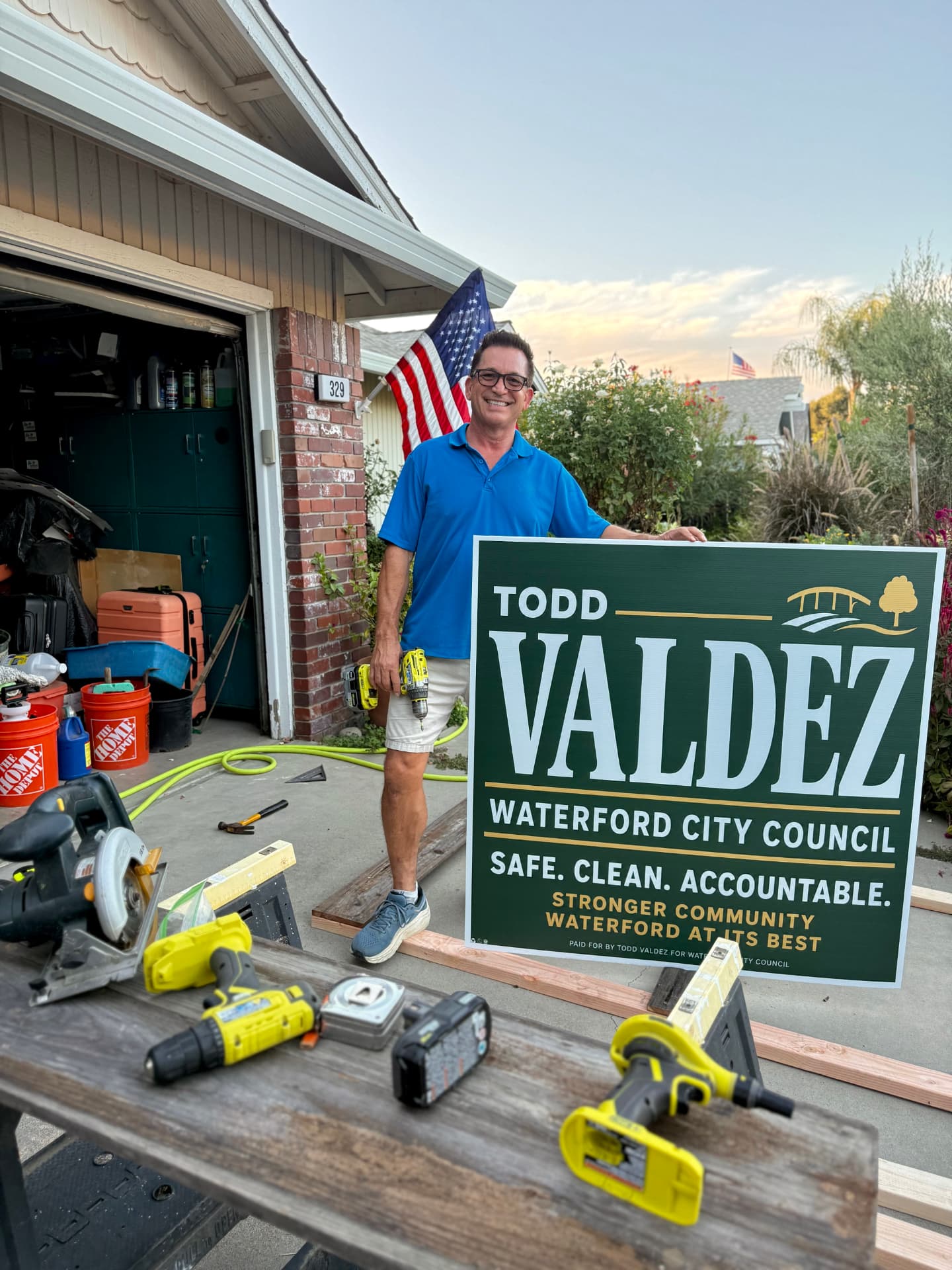 Todd working on a large campaign road sign
